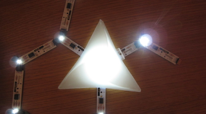 Circuit boards in the dark with a triangular lightshade